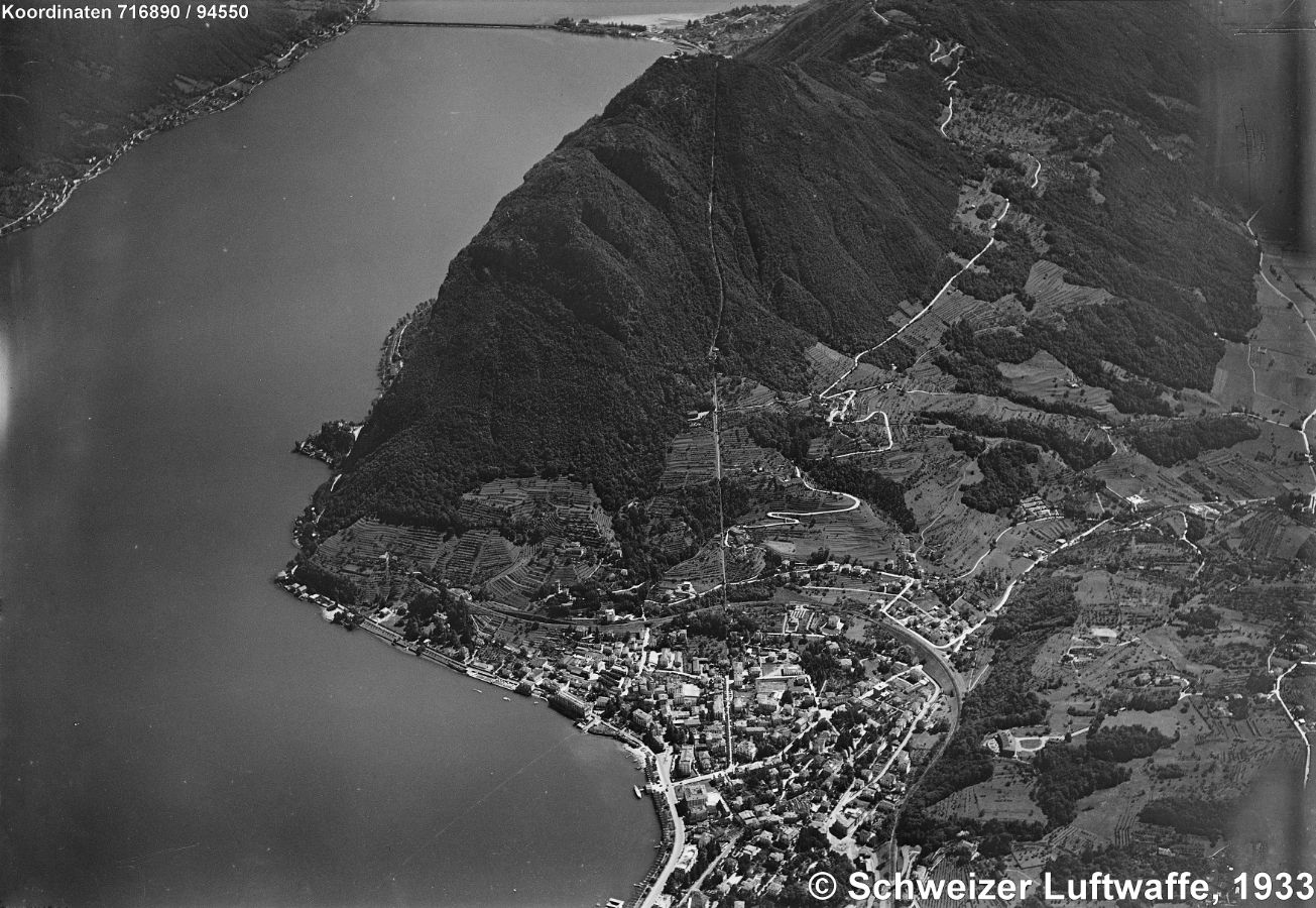 Monte San Salvatore um 1933. Die meterspurige Standseilbahn (Einweihung 1890) steigt von 282 auf 883 m.ü.M. mit 61% Steigung in 12 Minuten. Die Bahnanlage besteht aus zwei separaten Sektionen.